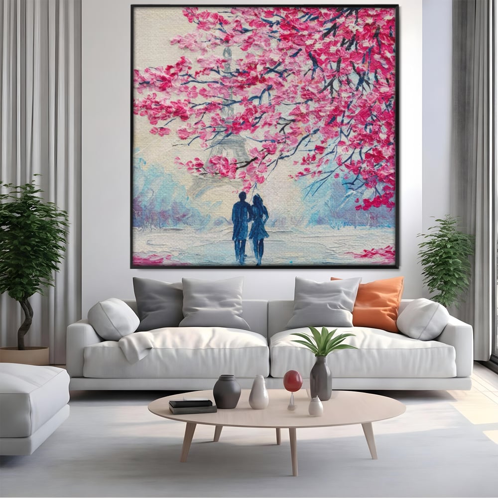 Tablou canvas cu tablou patrat cuplu sub pom roz, in rama de aluminiu negru, pe perete intr-un living